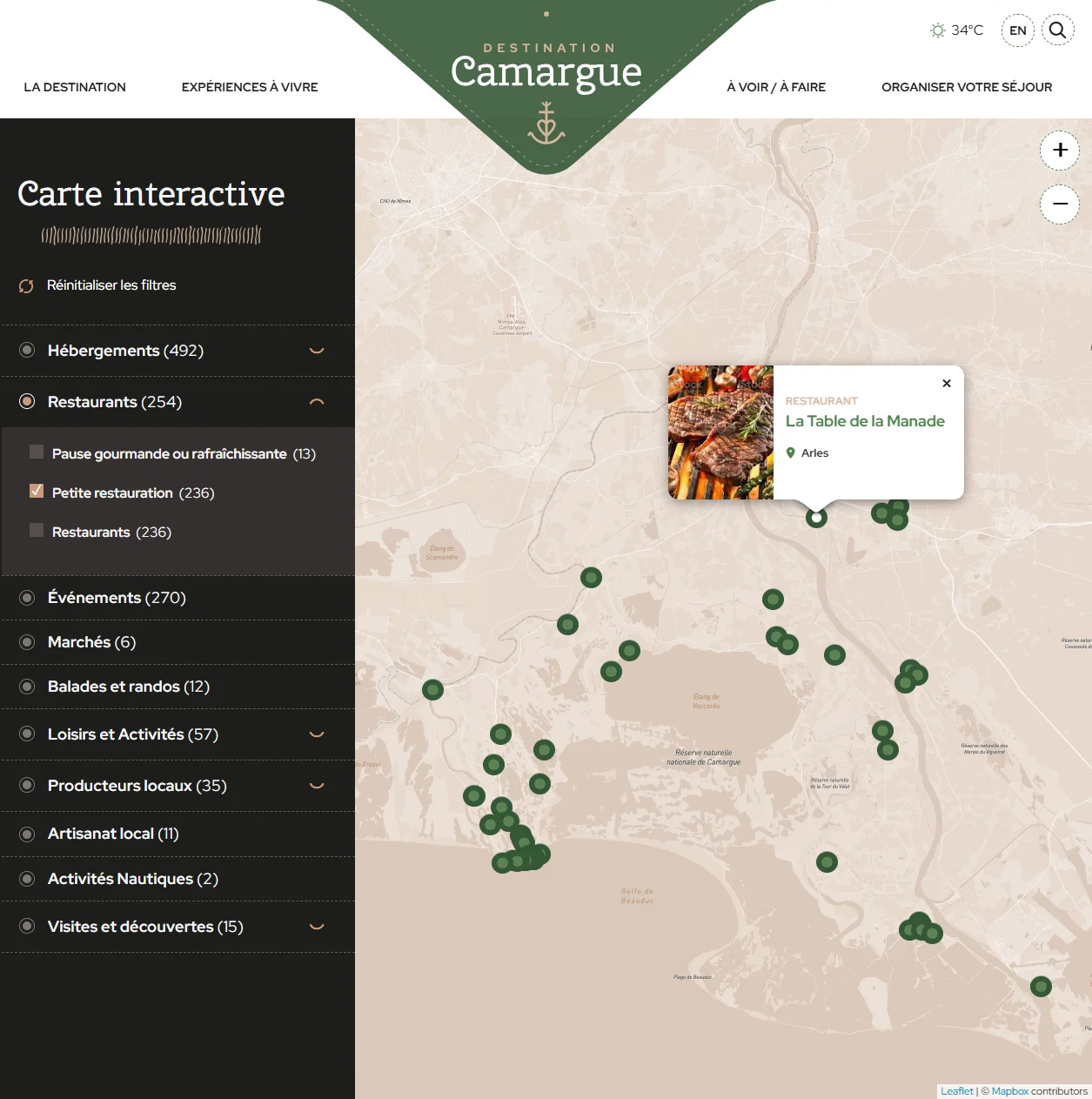 Fiche détaillée ouverte au clic sur un marqueur : photo, catégorie Restaurant, nom La Table de la Manade, ville Arles